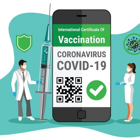 Covid-19 vaccine e-passport on a smartphone with QR code certificate e-passport app for international travel concept. Doctor holding Coronavirus vaccine syringe